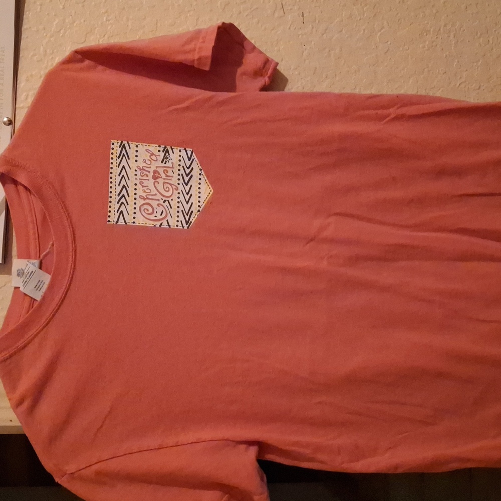 A pink graphic tee